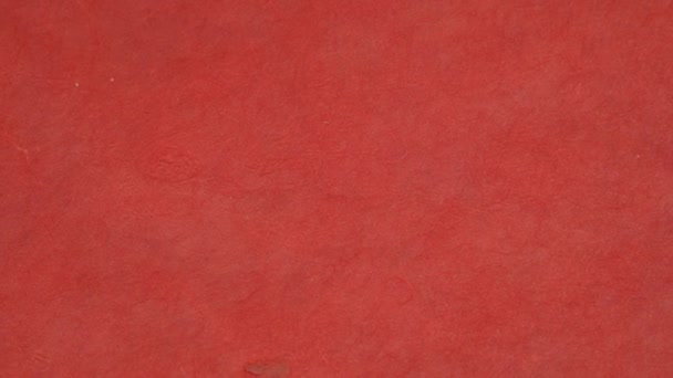 Drehen antiken farbigen Papierhintergrund Textur mit dunklem in alten Not Vintage-Design. Papierfarbe rot, weihnachtliche Textur - Filmmaterial, Video