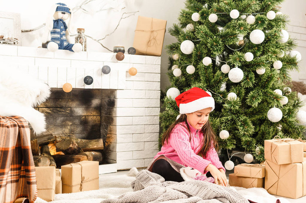 Cute girl at home at Christmas time - 写真・画像