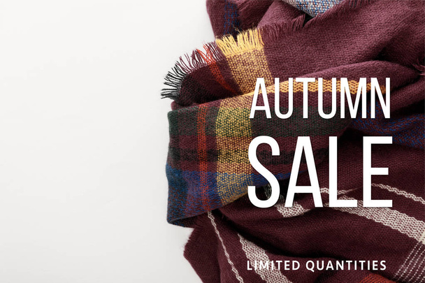 top view of burgundy wool plaid scarf on white background with autumn sale illustration  - Photo, Image