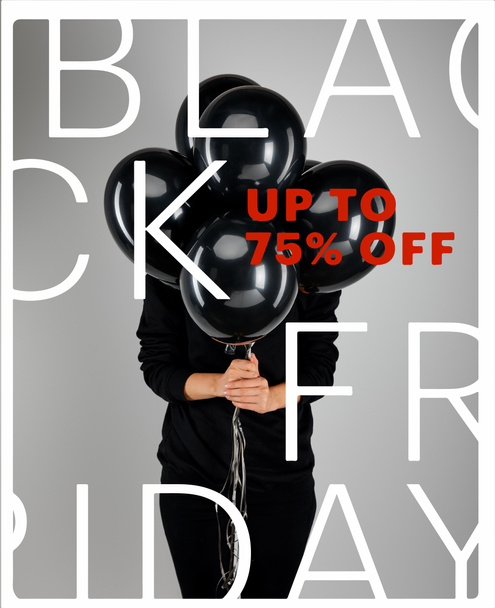 woman with obscure face holding bunch of black balloons isolated on grey with black Friday, up to 75 percent off illustration - Photo, Image