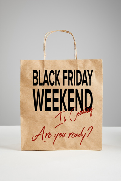 paper shopping bag with black Friday weekend illustration isolated on grey, black Friday concept - Photo, Image