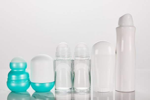 bottles of deodorant isolated on white - Fotó, kép