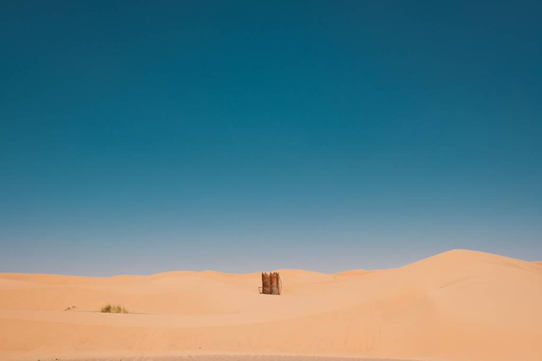 A beautiful view of the desert under the clear blue sky captured in Morocco - Photo, image