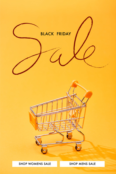 empty small shopping cart on bright orange background with black Friday sale illustration - Foto, Imagen