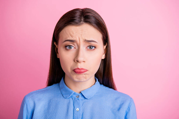 Photo of pretty lady with offended look and cute facial expression manipulating boyfriend to ask forgiveness wear blue dotted shirt isolated pink color background - 写真・画像