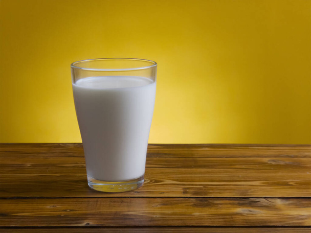 Glass with fresh milk on wooden table - Photo, Image