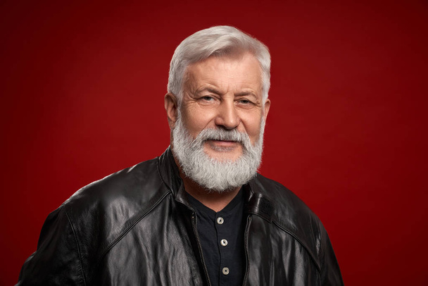 Portrait of confident aged man in black leather jacket - Photo, Image