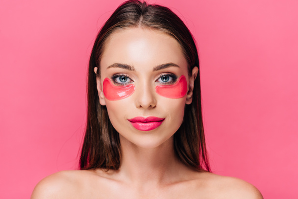 naked beautiful woman with eye patch on face isolated on pink  - Valokuva, kuva