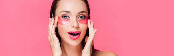 excited naked beautiful woman touching eye patch on face isolated on pink, panoramic shot - Photo, Image