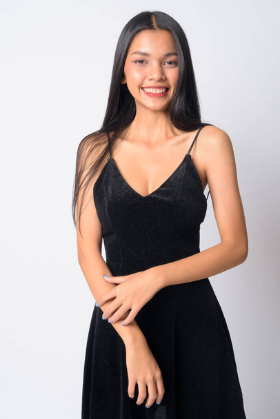 Portrait of happy young beautiful Asian woman smiling - Photo, image