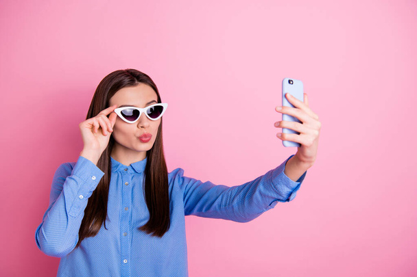 Photo of cheerful cute nice fun positive girlfriend wearing sunglass taking selfie having gone on vacation abroad isolated over pink pastel color background - Фото, изображение
