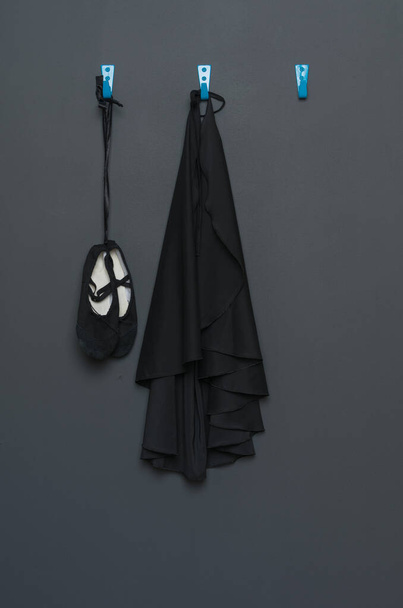 uniform for classical dance and ballet hanging on a gray background. - Fotoğraf, Görsel
