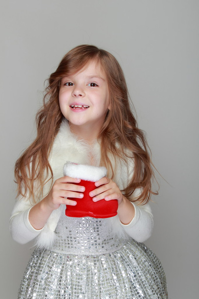 Girl holding a Christmas decoration - Φωτογραφία, εικόνα