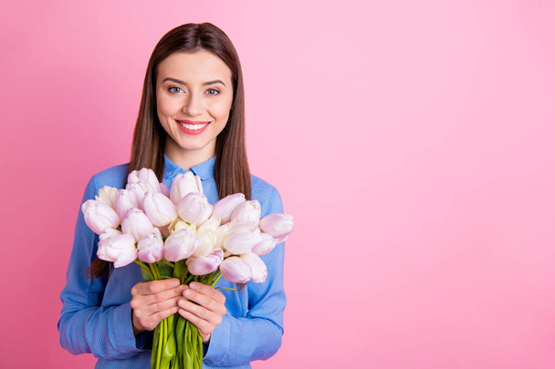 Photo of amazing lady holding big fresh white tulips bunch in hands best 8 march ever wear blue dotted shirt isolated pink color background - Фото, зображення
