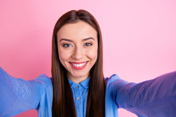 Close up self photo of cheerful fun positive sweet lovely cute lady taking selfie smiling toothily isolated over pink pastel color background - Zdjęcie, obraz