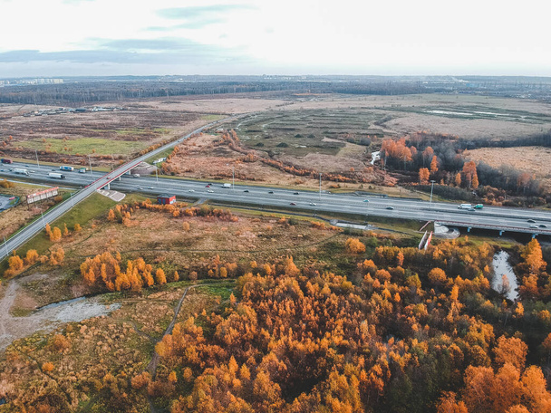 Aerial view suburban route along the fields. Autumn, St. Petersburg, Russia. - Foto, Imagen