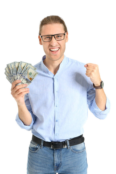 Happy young man with money on white background - Foto, afbeelding