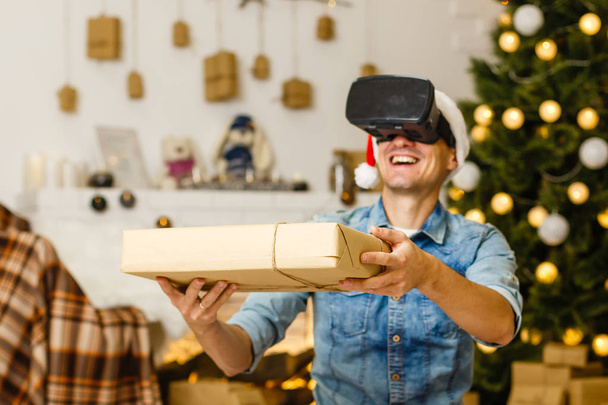 man in virtual 3D glasses at Christmas - Φωτογραφία, εικόνα