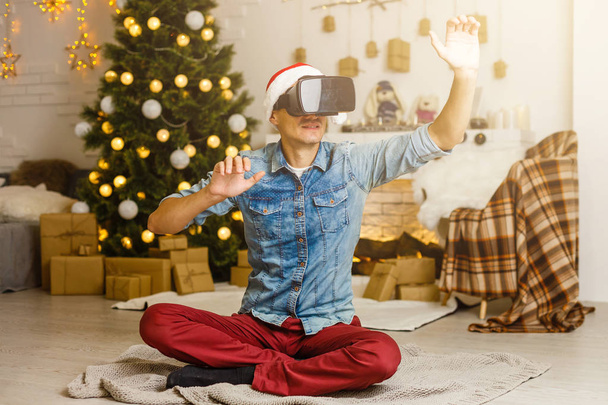 man in virtual 3D glasses at Christmas - 写真・画像
