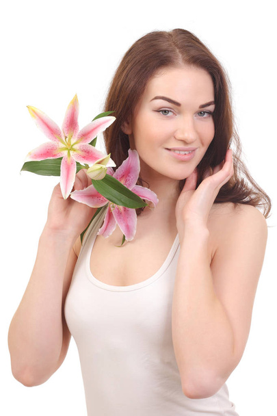 Beauty face of woman with lily flower - Foto, afbeelding