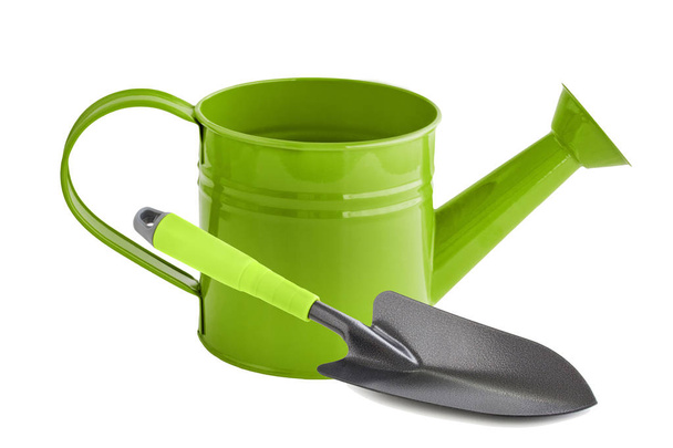 Green watering can and shovel - Photo, Image