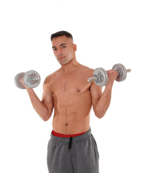 Closeup of a man with two dumbbells - Photo, Image