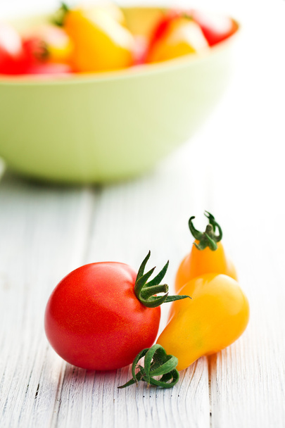 cherry tomatoes on table - Fotó, kép