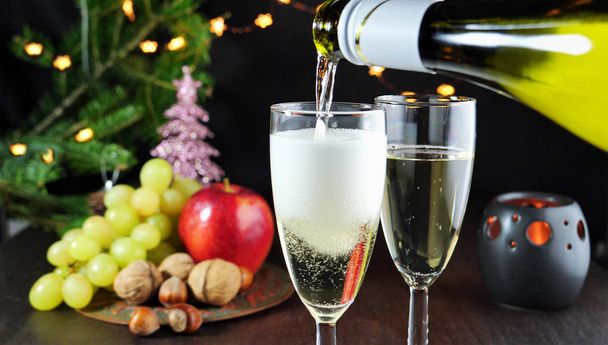 Pouring sparkling white wine in glasses - Photo, Image