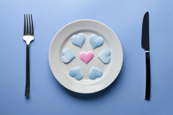 Hearts on plate. Woman and men love flirt. Choice among different sex partners. New girlfriend or boyfriend. Promiscuity and polygamy concept. - Photo, Image