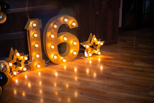 Happy birthday! BIrthday decoration for sixteen years old. Star lights. - Photo, Image