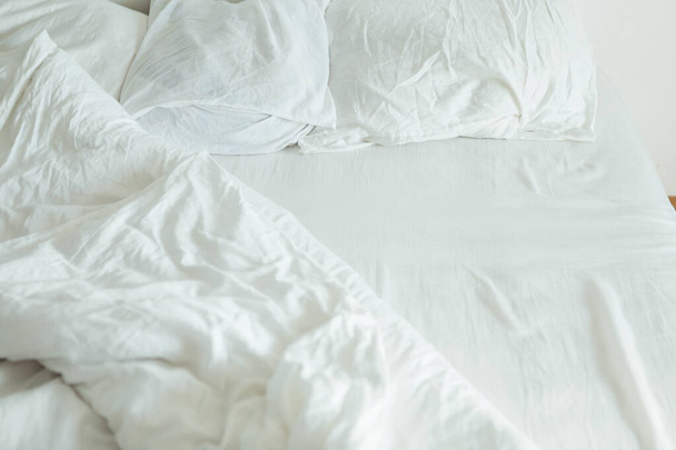 bed with white sheets close up bright light - Photo, Image