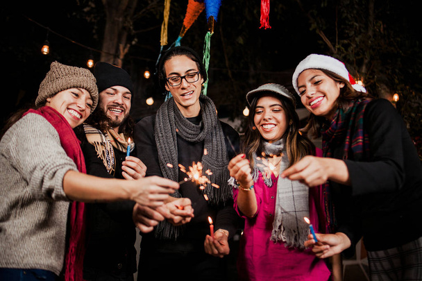Mexican Posada group of friends Singing carols in Christmas Mexico - Photo, Image
