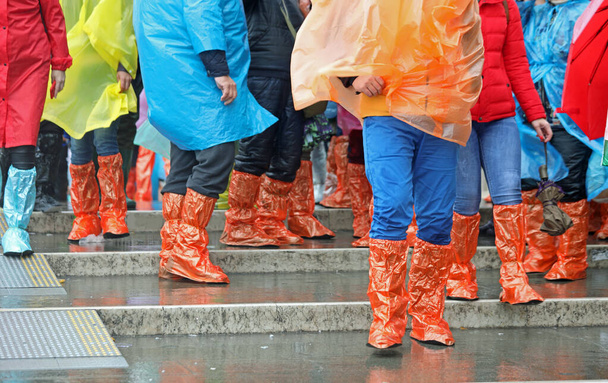 colorful waterproof gaiters and tourists during a visit to Venic - Photo, Image