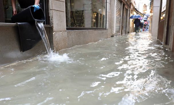 Venetian Street completely submerged by high tide and the emptyi - Photo, Image