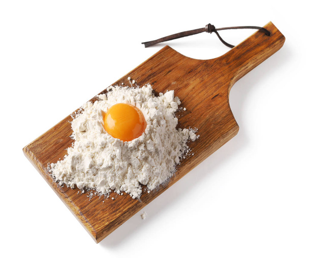 heap of flour and egg yolk - Photo, Image