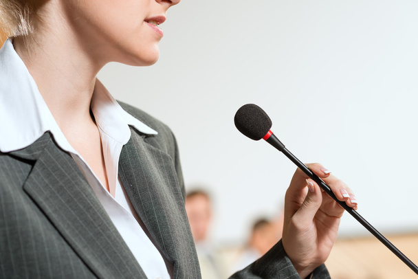 Portrait of a business woman with microphone - Фото, зображення