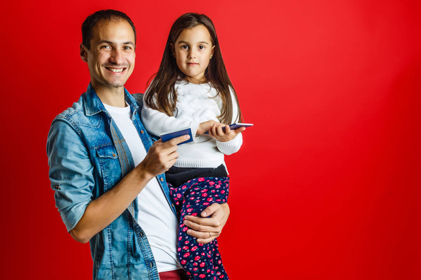 portrait of father and pretty daughter with new passports - Fotografie, Obrázek
