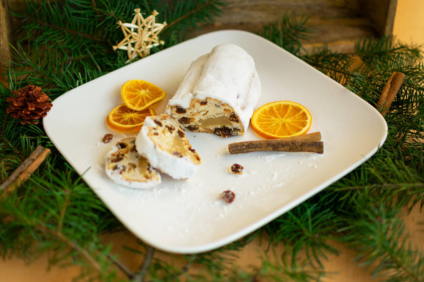 Baked apple stollen on white plate  - Photo, Image