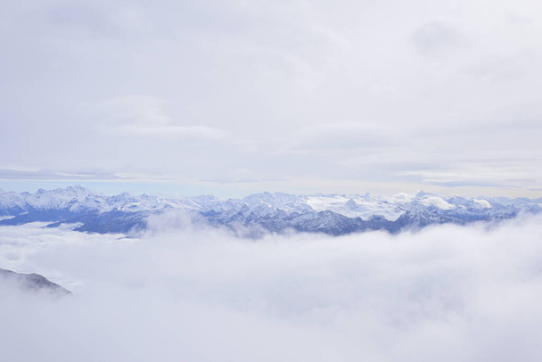 Mont Blanc. Aerial view of the Alps surrounded by clouds. - Photo, Image