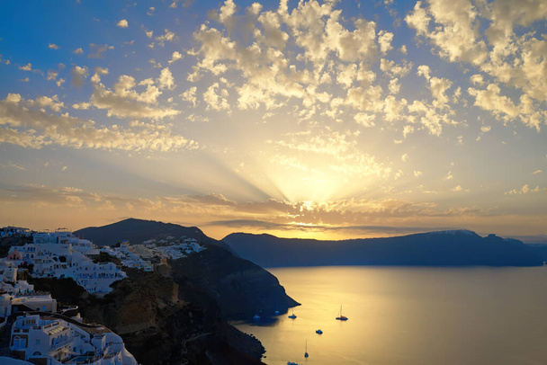 Oia village, sunrise over famous volcanic caldera. Santorini island, Greece. Toned image, space for your text. - 写真・画像