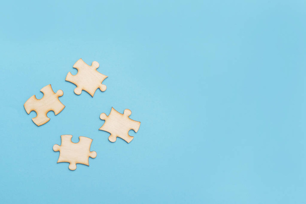 Wooden Jigsaw Puzzle On A Blue Background - Valokuva, kuva