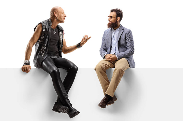 Bearded man listening to a punk talking on a panel  - Фото, изображение