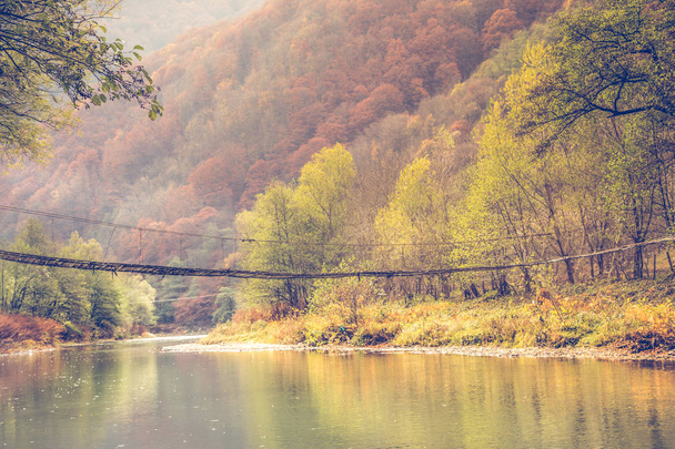 Old wooden bridge autumn background  - Photo, Image