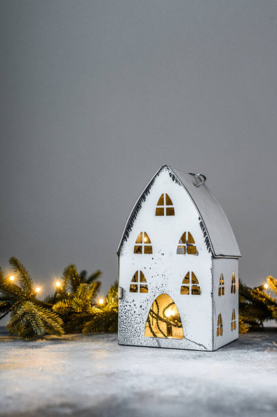 Christmas background, candlestick house with lights, fir branches and Christmas toys. Happy new year. - Foto, immagini