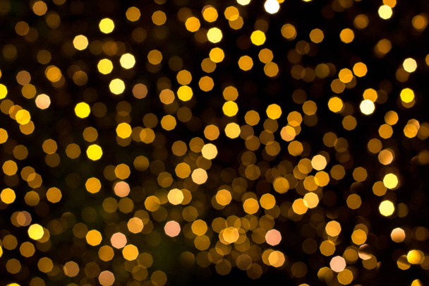 Gold glitter vintage lights texture background for Christmas. Defocused - Photo, image