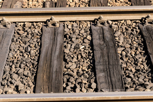 old railway sleepers with wood and pebbles - Photo, Image