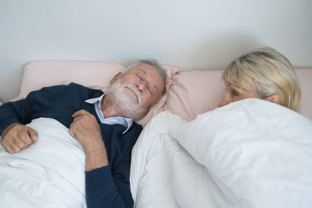 happy elderly couple caucasian senior man snoring and woman slee - Valokuva, kuva
