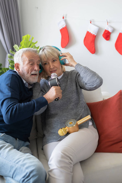 senior elderly old man and woman happy to sing song and listenin - Φωτογραφία, εικόνα