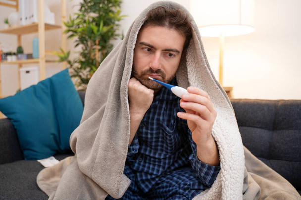 Man portrait suffering cold and flu at home - Fotoğraf, Görsel