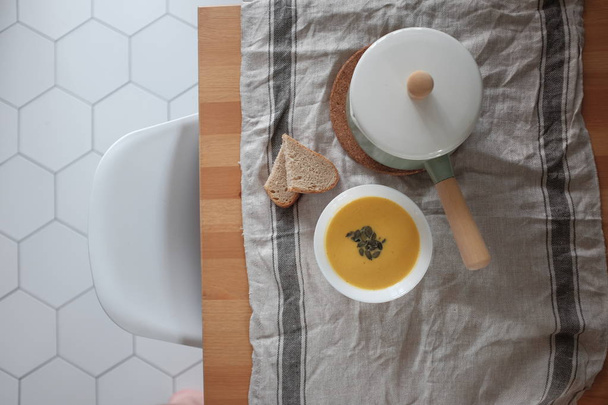 pumpkin cream soup on a wooden table. View from above. Healthy eating concept - Foto, Imagem